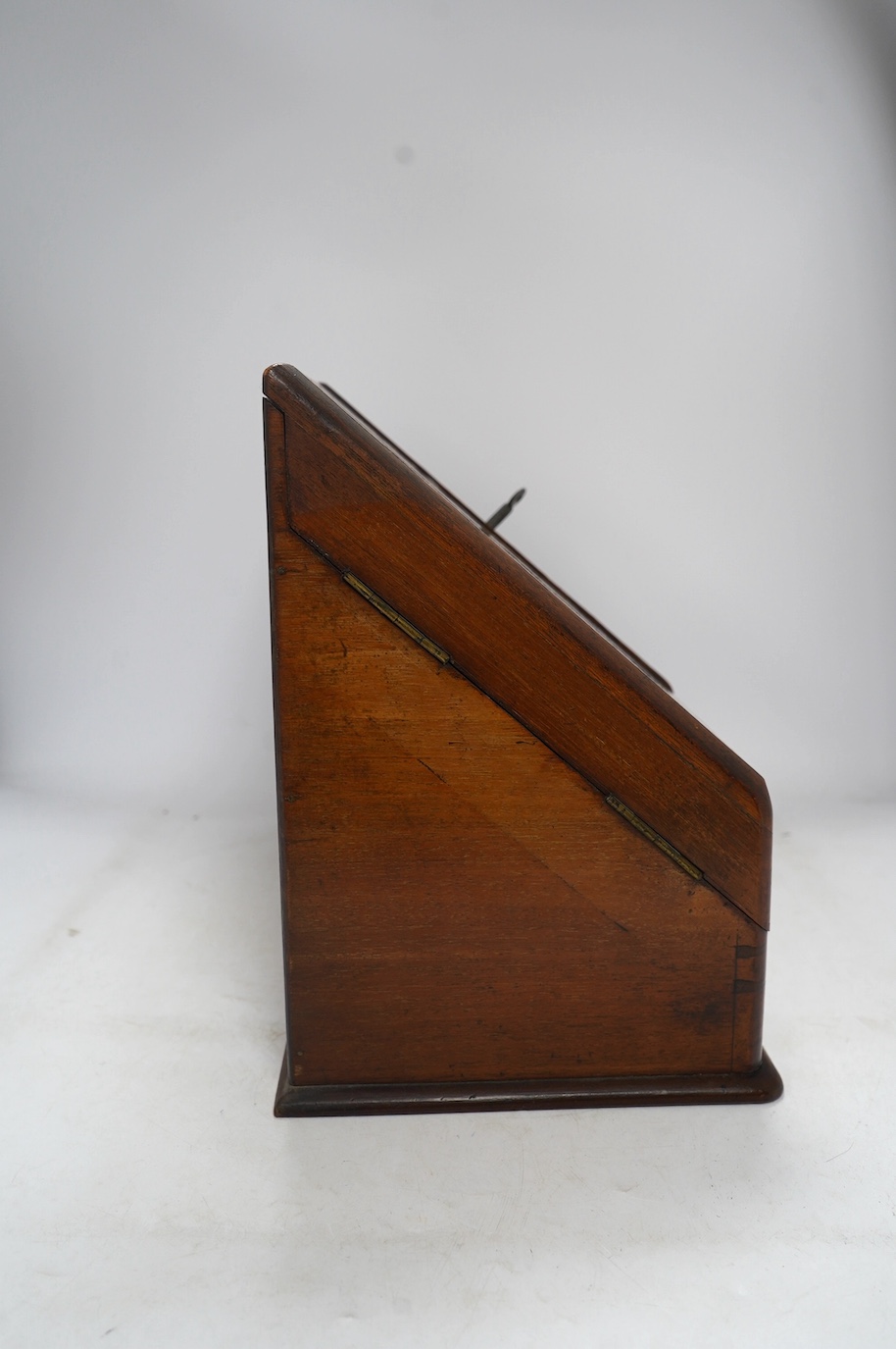 A Victorian burr walnut stationery rack, with two glass inkwells and partial label to the interior, with key, 37cm wide. Condition - fair